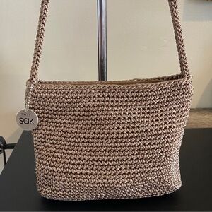 The Sak Metallic Taupe Crochet Shoulder Bag with Logo Charm